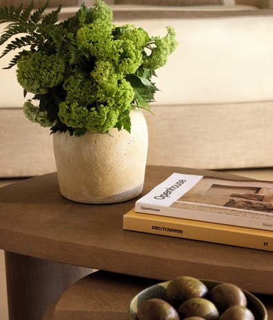 Deluxe Double Room Private Garden Sea View close-up shot of a modern wooden nested coffee table setup inside a luxury hotel suite at Sani Club by Kenwood Travel