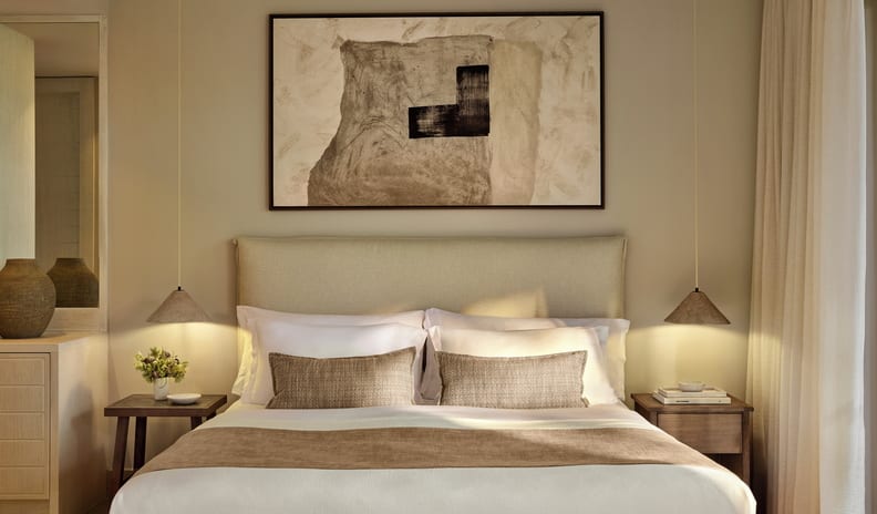 Double Room Ground Floor Sea View Large abstract artwork hangs centered above the bed, flanked by two warm cone-shaped pendant lights illuminating wooden nightstands on either side at Sani Club by Kenwood Travel