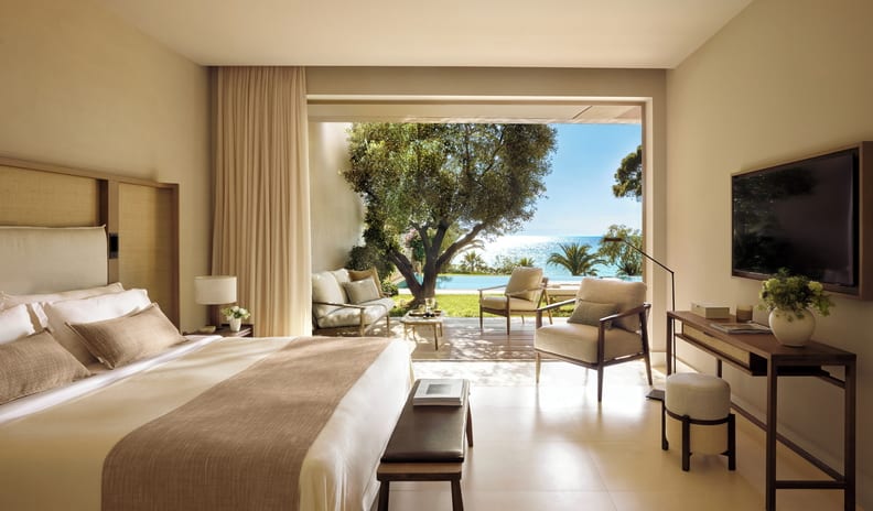 One Bedroom Bungalow Suite Private Pool Sea View Luxury hotel bedroom suite featuring a large open balcony with a private pool, patio furniture, and an ocean view at Sani Club by Kenwood Travel