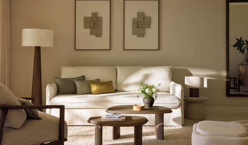 One Bedroom Bungalow Suite Private Pool Sea View Elegant luxury hotel suite living room with a cream sofa, organic wood tables, and warm minimalist decor at Sani Club by Kenwood Travel