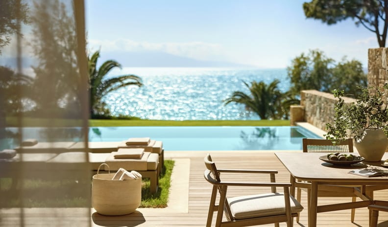 Two Bedroom Bungalow Suite PrIvate Pool Beach Front Sunlit luxury villa terrace with a private pool, sun beds, and scenic sea views at Sani Club by Kenwood Travel