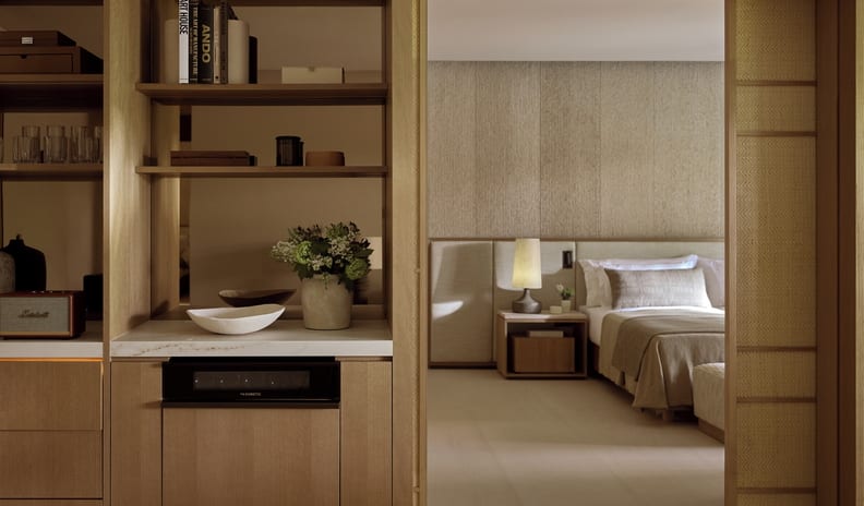 Three Bedroom Grand Residence Private Pool Garden View Premium villa room layout highlighting a built-in coffee station and refreshment bar next to a sliding divider door leading to the main bed at Sani Asterias by Kenwood Travel