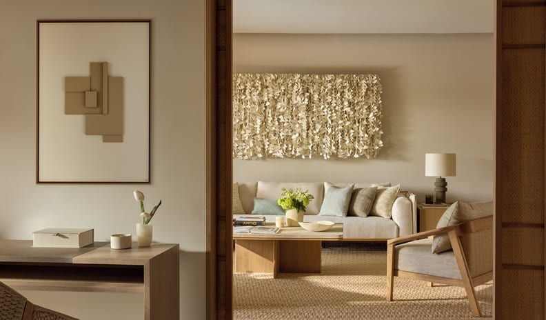 Three Bedroom Villa Pr. Pool Garden View living area of a luxury hotel suite, featuring premium neutral-toned furnishings, bespoke contemporary art pieces, and a serene, relaxing ambiance at Sani Asterias by Kenwood Travel