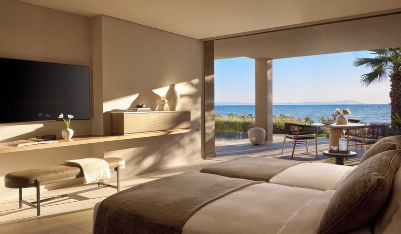 Two Bedroom Signature Residence Pr. Pool Beach Front minimalist hotel suite with twin beds overlooking a private patio, plunge pool, and a scenic ocean view during golden hour at Sani Asterias by Kenwood Travel