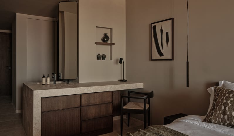 Classic Room with Shared Pool Minimalist stone vanity counter and desk setup in an earth-toned luxury bedroom at OKU Bodrum by Kenwood Travel