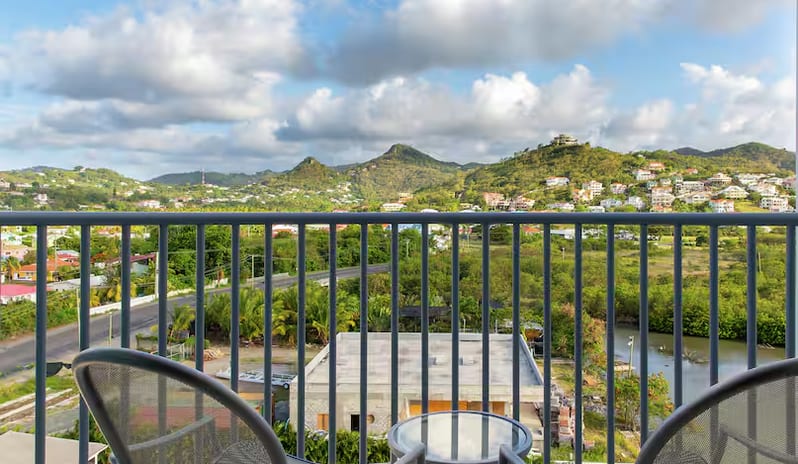 Mountain View Terrace King balcony terrace with a scenic mountain and island landscape view at Harbor Club St. Lucia, Curio Collection by Hilton by Kenwood Travel