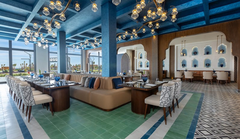 Hayal Restaurant Upscale fine dining room interior with unique blue ceiling architecture and geometric tile flooring at Rixos Radamis Sharm El Sheikh by Kenwood Travel