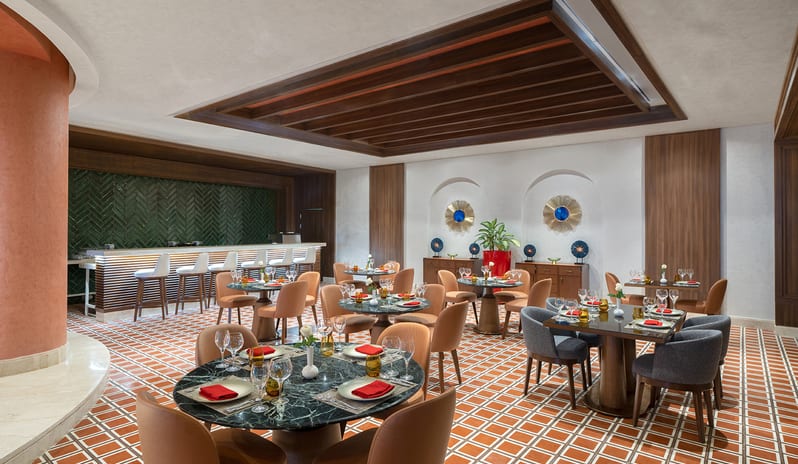 Cactus Upscale dining room seating and bar counter interior at Rixos Radamis Sharm El Sheikh by Kenwood Travel