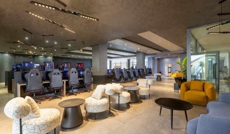 E-Sport Café Luxury hotel gaming center and esports lounge featuring modern sofa seating and multiple PC gaming stations at Rixos Radamis Sharm El Sheikh by Kenwood Travel