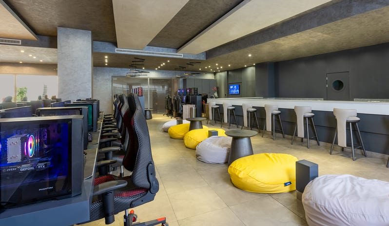 E-Sport Café Luxury hotel gaming center and esports lounge featuring modern sofa seating and multiple PC gaming stations at Rixos Radamis Sharm El Sheikh by Kenwood Travel