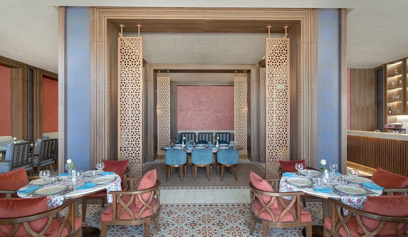 Lalezar Symmetrical dining room seating area featuring terracotta and teal chairs with traditional Turkish design details at Rixos Radamis Sharm El Sheikh by Kenwood Travel