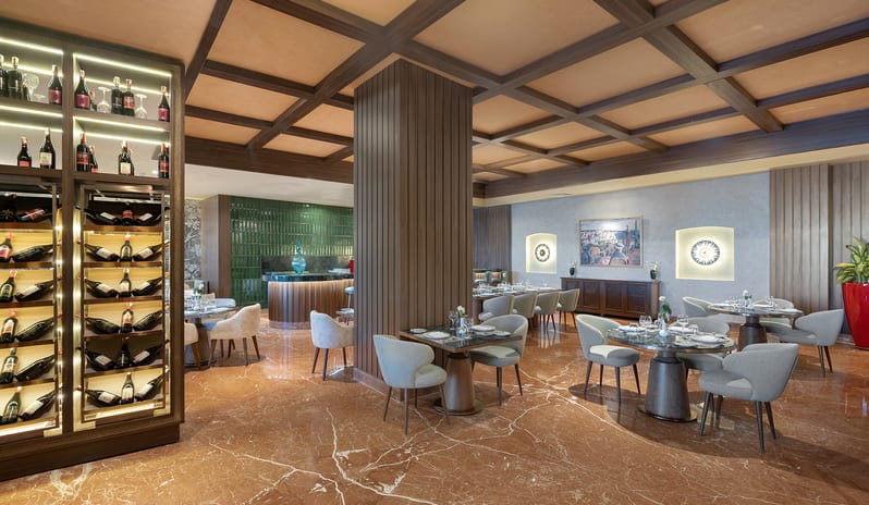 L'Olivio Fine dining room and custom wine display cabinet inside at Rixos Radamis Sharm El Sheikh by Kenwood Travel