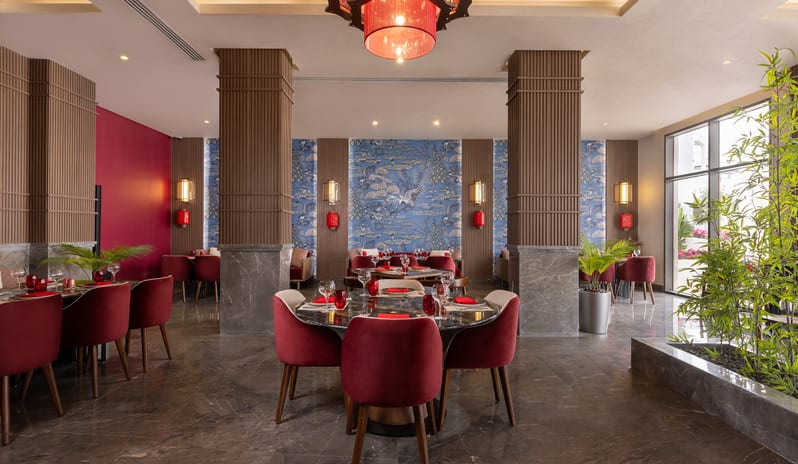 Mandarin Fine dining room setup with red velvet chairs and traditional Asian decor at Rixos Radamis Sharm El Sheikh by Kenwood Travel