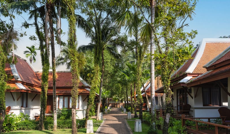 Oriental Villa exterior buildings and garden walkway at Khaolak Laguna Resort by Kenwood Travel