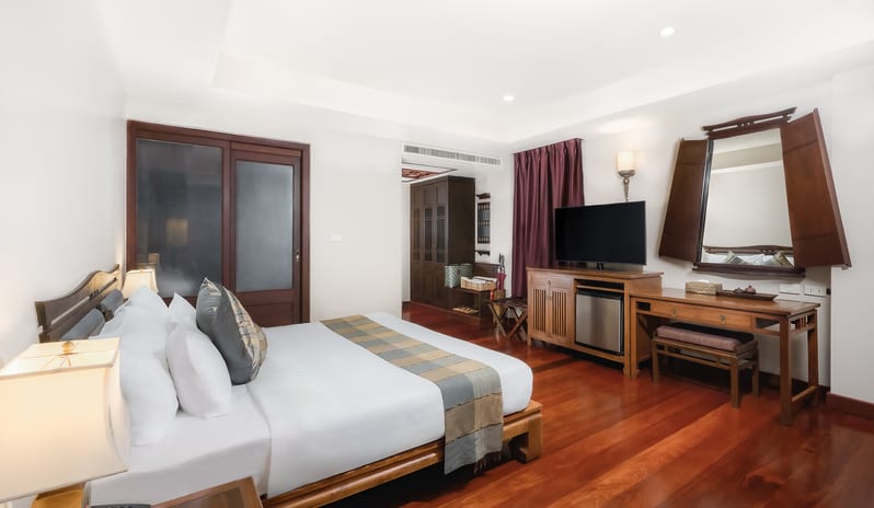 Siam Chaletat Polished hardwood floors and traditional wooden furniture inside at Khaolak Laguna Resort by Kenwood Travel