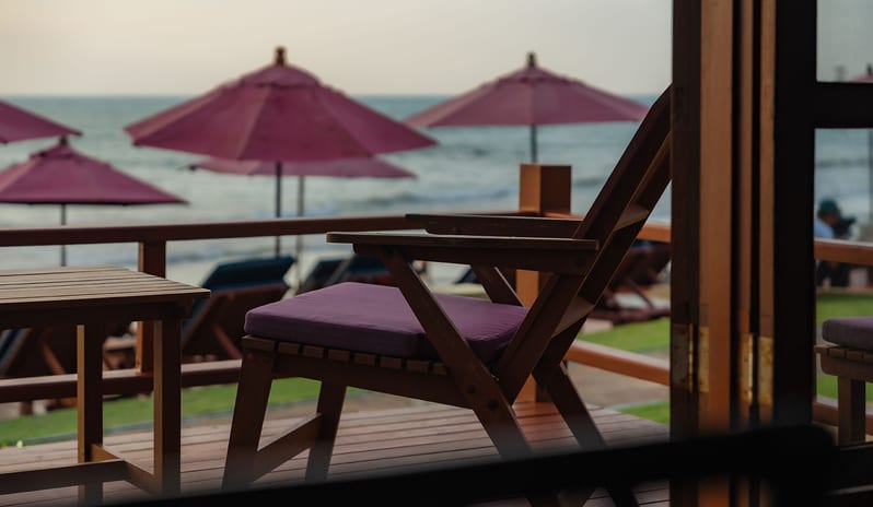 Similan Pearl private terrace seating with a direct ocean view at Khaolak Laguna Resort by Kenwood Travel
