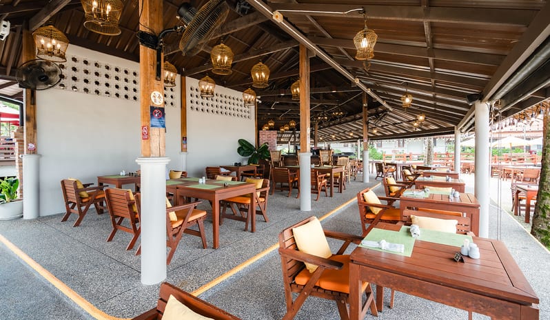 Sundowner Beachside Terrace covered terrace interior and dining tables at Khaolak Laguna Resort by Kenwood Travel