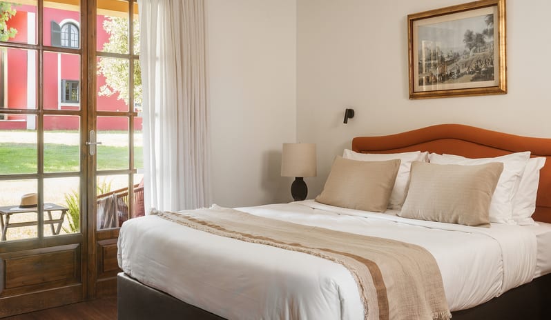 Family Interconnecting Apartment with Veranda with comfortable bedding and a view of the garden veranda at Grecotel LUXME Costa Botanica by Kenwood Travel