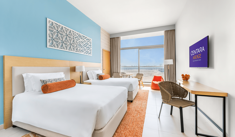 King Family Room Double Double family hotel room in Dubai with double double beds, desk, and balcony view at Centara Mirage Beach Resort Dubai by Kenwood Travel