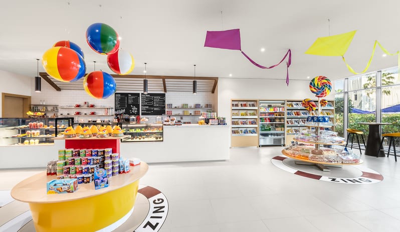 Zing candy display, snack tables, beach ball decorations, and a bakery display case at Centara Mirage Beach Resort Dubai by Kenwood Travel