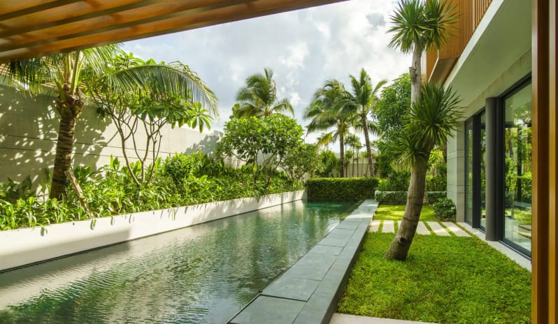 Signature Two Bedroom Deluxe Pool Villa private swimming pool and tropical garden backyard of a Castor Villa at Sailing Club Signature Resort Phu Quoc Hotel by Kenwood Travel