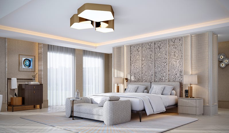 Serenity Villa bedroom with a decorative textured headboard wall, plush bed bench, patterned rug, and bright floor-to-ceiling windows at Gloria Serenity Resort by Kenwood Travel