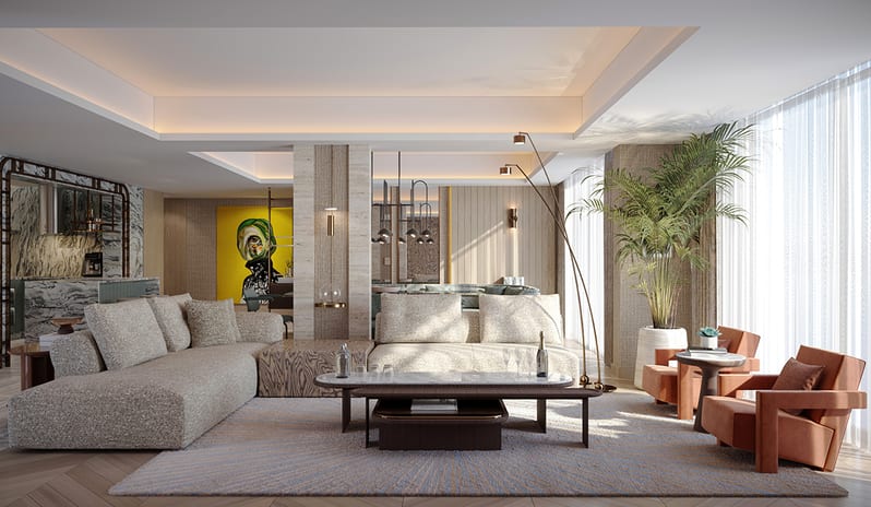 Queen & King Villa large textured sectional sofa, terracotta armchairs, a marble coffee table, and an open-plan layout showing the kitchen area at Gloria Serenity Resort by Kenwood Travel