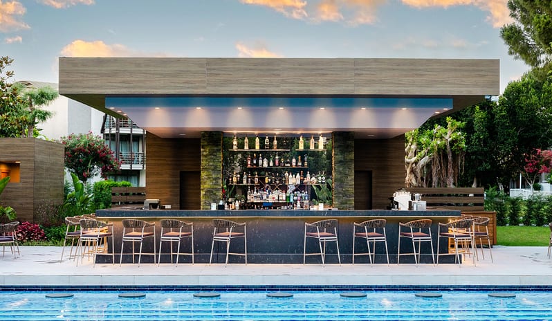 Olivium Pool Bar front view and outdoor swimming pool lounge at Gloria Serenity Resort by Kenwood Travel