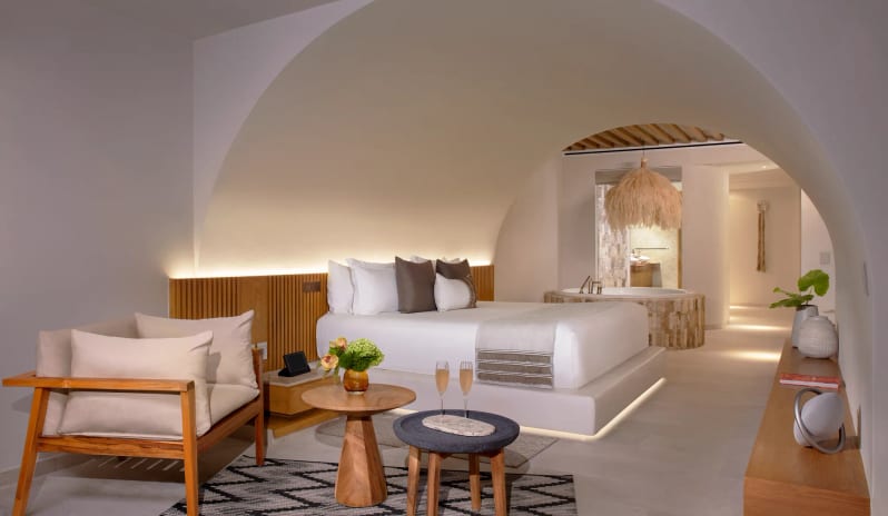Presidential Suite king suite bedroom with custom arch architecture and private indoor jacuzzi tub at Impression Isla Mujeres by Secrets by Kenwood Travel