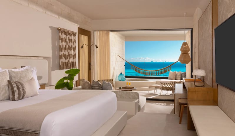 Signature Junior Suite Double Ocean Front W/ Hot Tub Hot Tub terrace hammock and hot tub at Impression Isla Mujeres by Secrets by Kenwood Travel