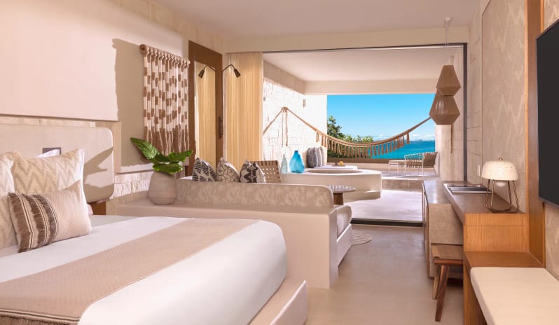 Signature Junior Suite King Ocean View W/ Hot Tub king suite with private balcony tub and hammock at Impression Isla Mujeres by Secrets by Kenwood Travel