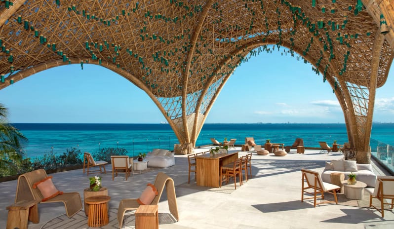 The Temple rooftop terrace with a unique architectural bamboo canopy and panoramic ocean views at Impression Isla Mujeres by Secrets by Kenwood Travel