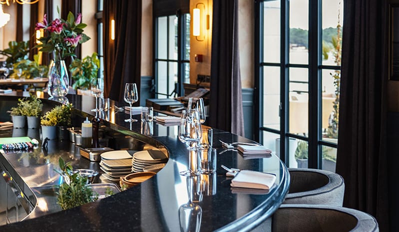 JAZ by Ana Roš Poreč Close-up of the elegant curved dark marble bar counter set with wine glasses at Pical Resort, Valamar Collection by Kenwood Travel