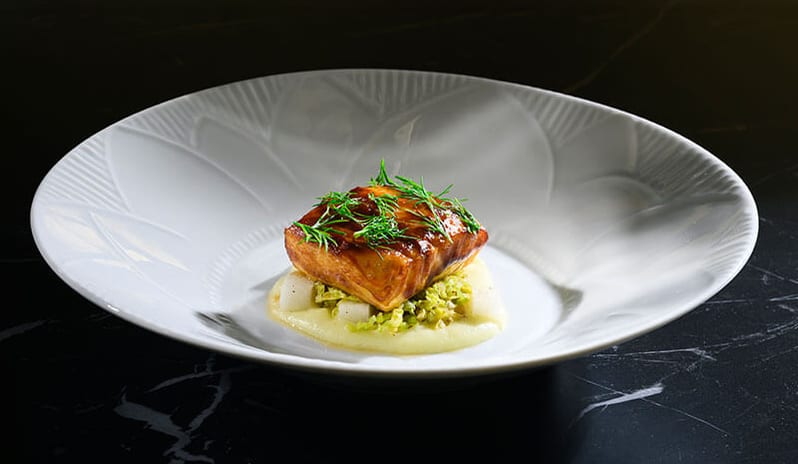 Harry’s Piccolo Poreč Gourmet glazed fish dish on a white ceramic plate at Pical Resort, Valamar Collection by Kenwood Travel