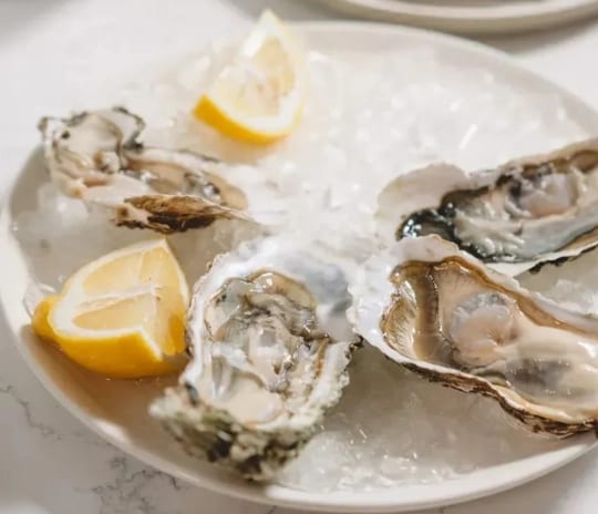 Nikos by Athinagoras Kostakos Fresh oysters on crushed ice with lemon at Moon Palace The Grand Punta Cana by Kenwood Travel
