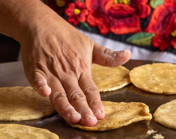 La Cantina Fresh handmade corn tortillas cooking on a comal griddle at Moon Palace The Grand Punta Cana by Kenwood Travel