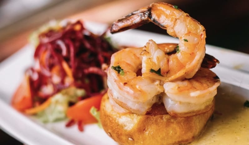 Nikos by Athinagoras Kostakos Grilled prawns on toasted brioche with side salad at Moon Palace The Grand Punta Cana by Kenwood Travel