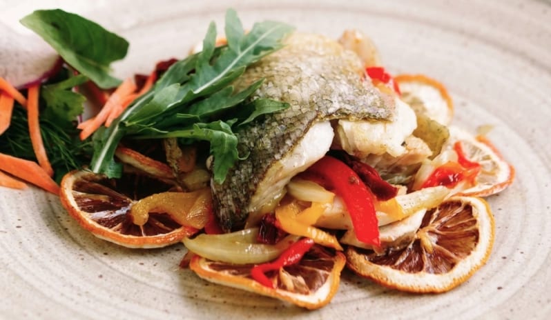 Nikos by Athinagoras Kostakos Pan-seared fish fillet served over Mediterranean vegetables at Moon Palace The Grand Punta Cana by Kenwood Travel