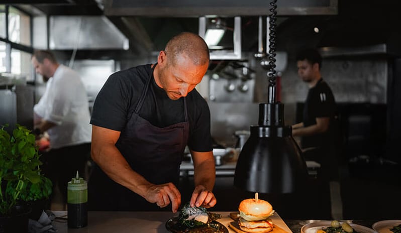Fogo by Bekal Chef preparing gourmet dishes in the restaurant kitchen at Pical Resort, Valamar Collection by Kenwood Travel