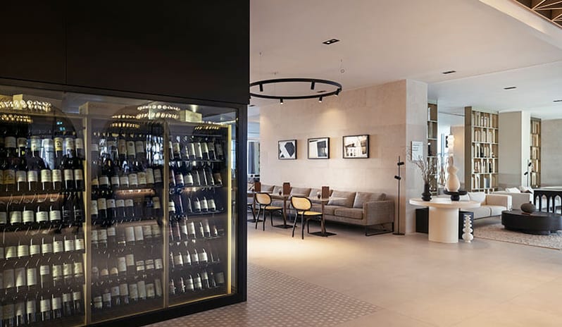 Mozaik Bar Illuminated glass wine cabinet and seating area at Pical Resort, Valamar Collection by Kenwood Travel