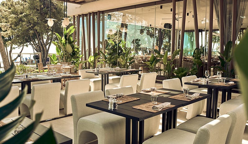 Purobeach Poreč Modern outdoor dining terrace with set tables at Pical Resort, Valamar Collection by Kenwood Travel