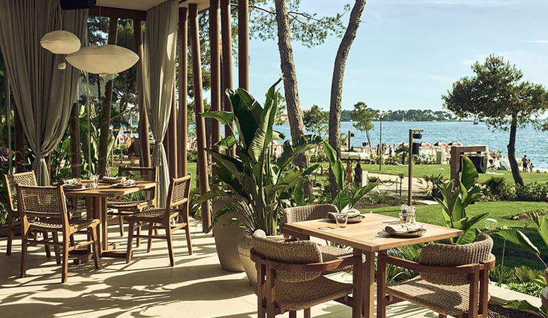 Purobeach Poreč Seaside restaurant patio tables overlooking the water at Pical Resort, Valamar Collection by Kenwood Travel