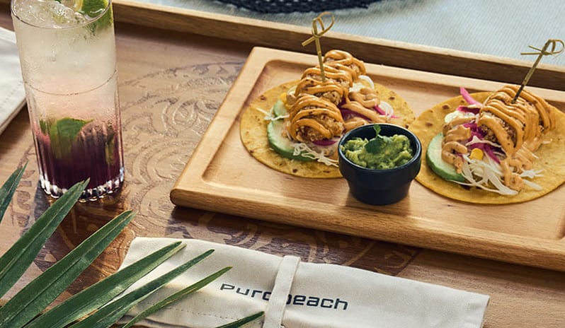 Purobeach Poreč Tacos and a cocktail served on a wooden tray at Pical Resort, Valamar Collection by Kenwood Travel