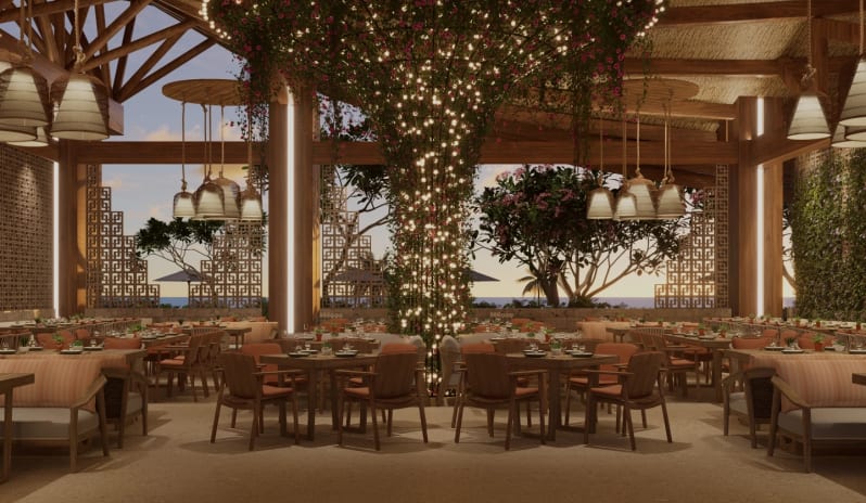 Madremía Luxury open-air beachside restaurant with warm ambient lighting and central fairy-light pillar at Moon Palace The Grand Punta Cana by Kenwood Travel