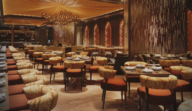 Habibi Elegant fine dining restaurant dining room with opulent golden decor at Moon Palace The Grand Punta Cana by Kenwood Travel