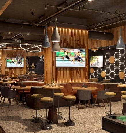 League’s Modern sports bar lounge with high tables, TV screens broadcasting sports, and stylish lighting at Moon Palace The Grand Punta Cana by Kenwood Travel