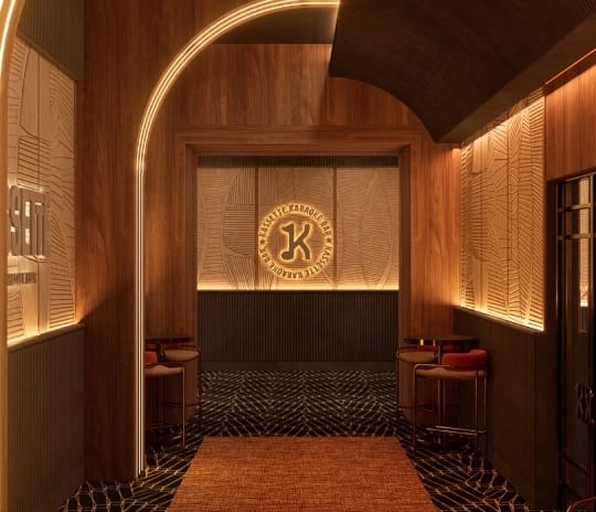 Kassette warm wood paneling, glowing neon archways, a textured carpet, and a backlit logo focal wall at the end of the corridor at Moon Palace The Grand Punta Cana by Kenwood Travel