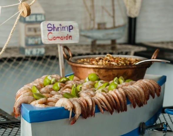 Joe´s Deck Fresh chilled shrimp with lime wedges served in a nautical wooden boat display at Moon Palace The Grand Punta Cana by Kenwood Travel