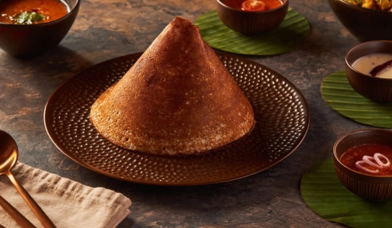 Agra Crispy South Indian cone dosa served with traditional sambar and chutney varieties at Moon Palace The Grand Punta Cana by Kenwood Travel