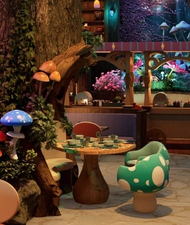 Wonderwoods Enchanted forest lounge entrance with a circular wooden door and hanging foliage at Moon Palace The Grand Punta Cana by Kenwood Travel